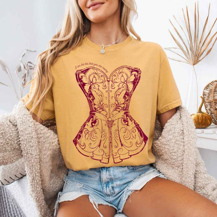 May include a person wearing a Mustard I Am The Tea That You Are Having Comfort Colors T-Shirt featuring royal court inspired graphic and relaxed fit.