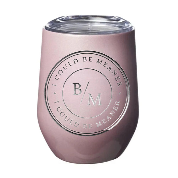 May include a wine tumbler displayed on a wooden surface, featuring a circular black design with the text “I COULD BE MEANER” repeated around the outer ring and the initials “B/M” centered inside. 