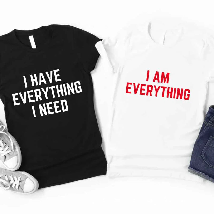 May include a couples t-shirt design featuring the phrase “I Have Everything I Need” and "I Am Everything|in clear, balanced lettering, often paired with a small heart or matching graphic that reflects love, gratitude, and partnership.