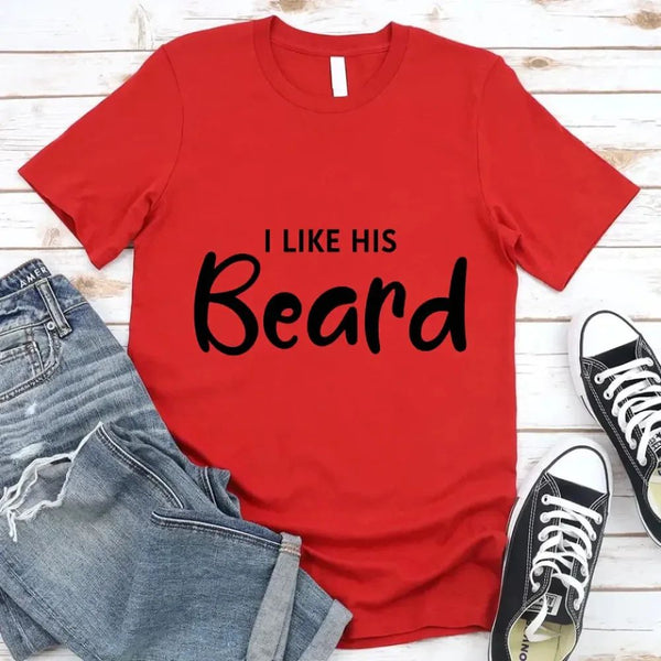 May include a pair of unisex couple t-shirts reading “I Like His Beard” and “I Like Her Butt,” displayed side by side in black and white cotton.
