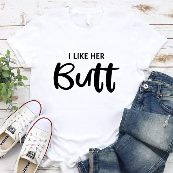 May include a pair of unisex couple t-shirts reading “I Like His Beard” and “I Like Her Butt,” displayed side by side in black and white cotton.