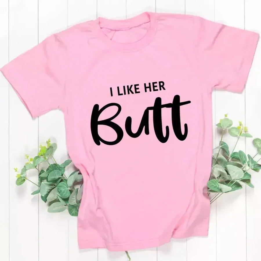 May include a pair of unisex couple t-shirts reading “I Like His Beard” and “I Like Her Butt,” displayed side by side in black and white cotton.