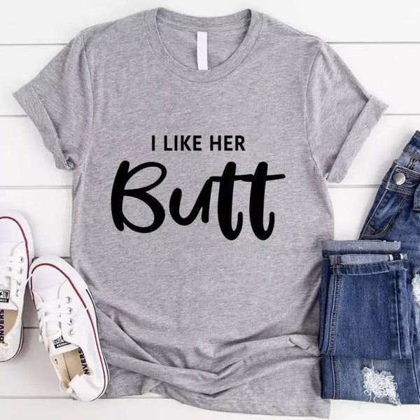 May include a pair of unisex couple t-shirts reading “I Like His Beard” and “I Like Her Butt,” displayed side by side in black and white cotton.