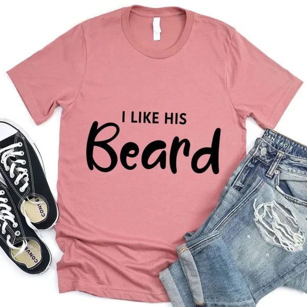 May include a pair of unisex couple t-shirts reading “I Like His Beard” and “I Like Her Butt,” displayed side by side in black and white cotton.