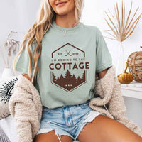May include a person wearing a Bay I’m Coming to the Cottage T-Shirt featuring rivalry inspired graphic design and relaxed fit.