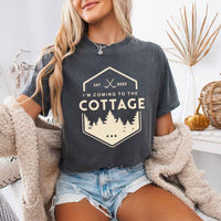 May include a person wearing a Pepper I’m Coming to the Cottage T-Shirt featuring rivalry inspired graphic design and relaxed fit.