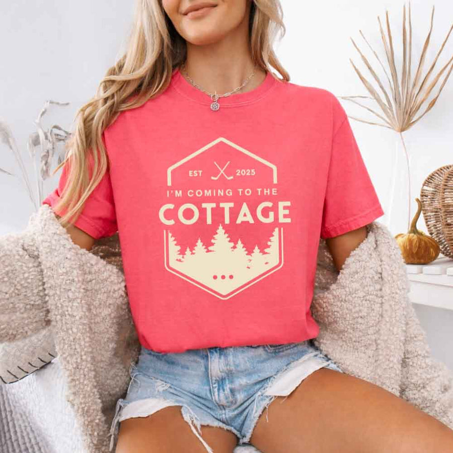 May include a person wearing a Watermelon I’m Coming to the Cottage T-Shirt featuring rivalry inspired graphic design and relaxed fit.