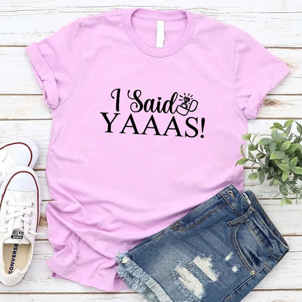 May include Lilac I Said YAAAS Bachelorette Crew Party Matching T-Shirts, featuring "I Said YAAAS" and "Bride" graphics, made from soft cotton for comfort and perfect for group photos at bachelorette parties.