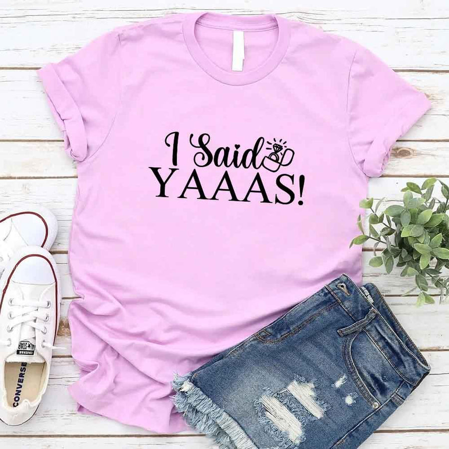 May include Lilac I Said YAAAS Bachelorette Crew Party Matching T-Shirts, featuring "I Said YAAAS" and "Bride" graphics, made from soft cotton for comfort and perfect for group photos at bachelorette parties.