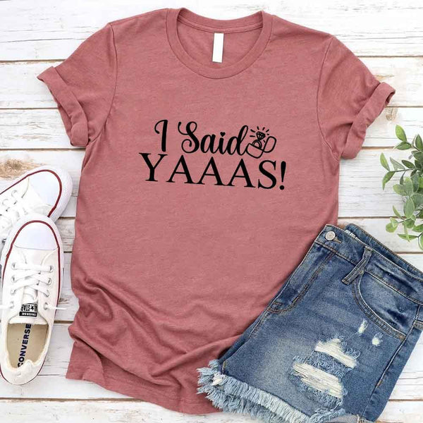 May include Mauve I Said YAAAS Bachelorette Crew Party Matching T-Shirts, featuring "I Said YAAAS" and "Bride" graphics, made from soft cotton for comfort and perfect for group photos at bachelorette parties.