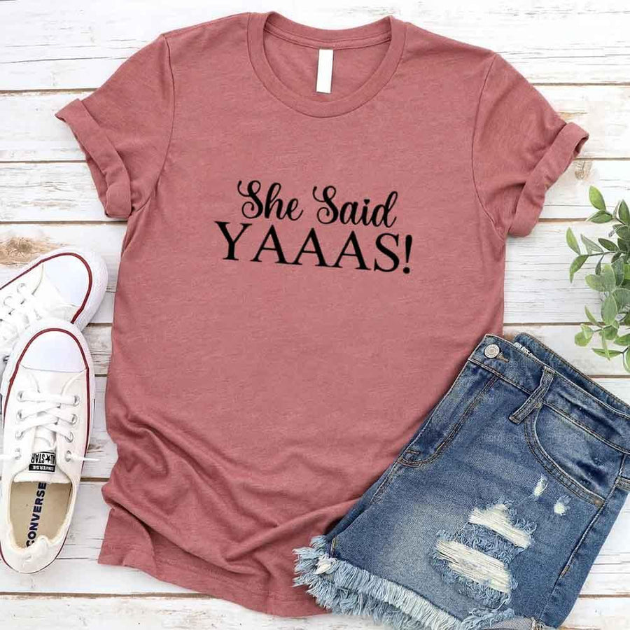 May include Mauve I Said YAAAS Bachelorette Crew Party Matching T-Shirts, featuring "I Said YAAAS" and "Bride" graphics, made from soft cotton for comfort and perfect for group photos at bachelorette parties.