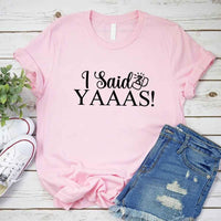 May include Pink I Said YAAAS Bachelorette Crew Party Matching T-Shirts, featuring "I Said YAAAS" and "Bride" graphics, made from soft cotton for comfort and perfect for group photos at bachelorette parties.