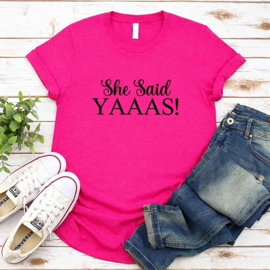 May include Heliconia I Said YAAAS Bachelorette Crew Party Matching T-Shirts, featuring "I Said YAAAS" and "Bride" graphics, made from soft cotton for comfort and perfect for group photos at bachelorette parties.