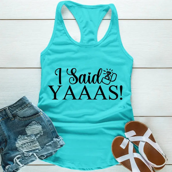 A teal tank top with the words “I Said Yaaaas!”