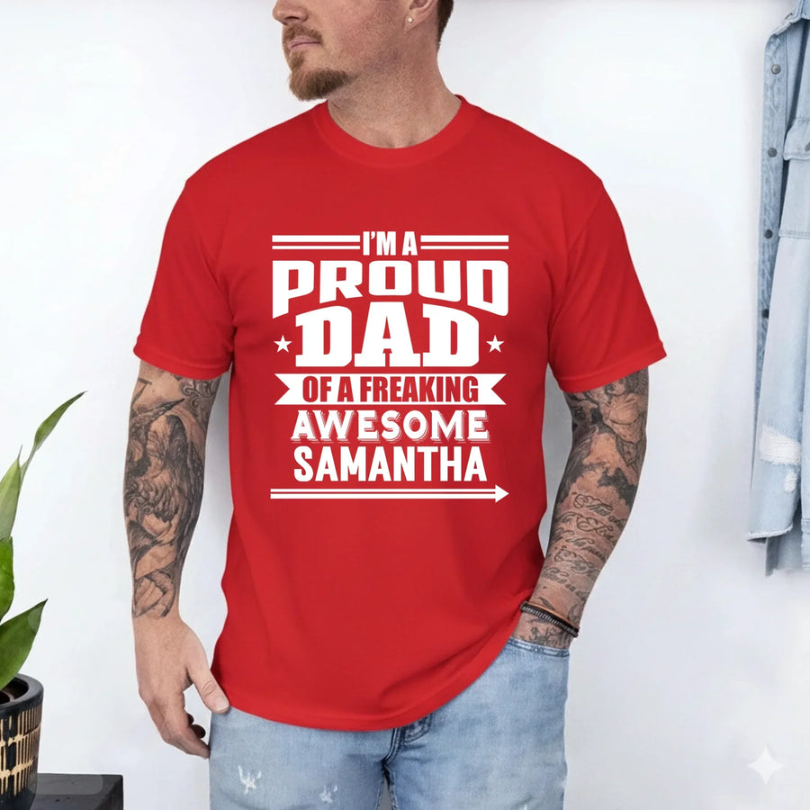 May include a father and child wearing matching t-shirts reading “I’m A Proud Dad” and “Me”