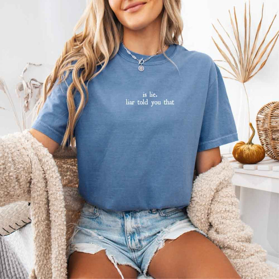 May include a person wearing a Denim Is Lie Liar Told You That Comfort Colors T-Shirt featuring rivalry inspired graphic and relaxed fit.