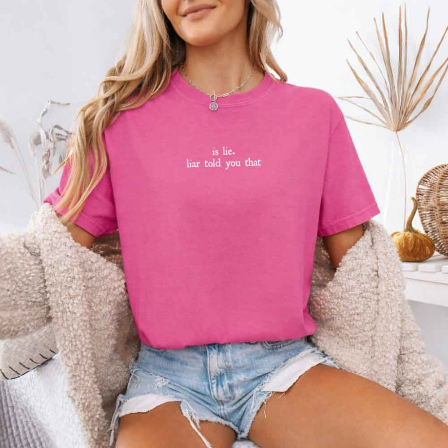 May include a person wearing a Crunchberry Is Lie Liar Told You That Comfort Colors T-Shirt featuring rivalry inspired graphic and relaxed fit.