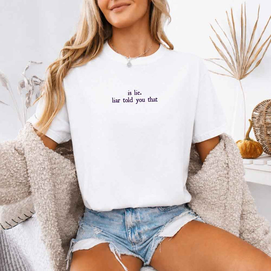 May include a person wearing a White Is Lie Liar Told You That Comfort Colors T-Shirt featuring rivalry inspired graphic and relaxed fit.