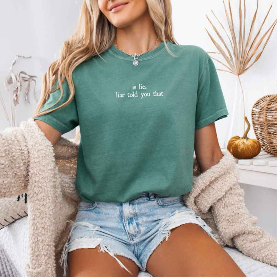 May include a person wearing a Light Green Is Lie Liar Told You That Comfort Colors T-Shirt featuring rivalry inspired graphic and relaxed fit.