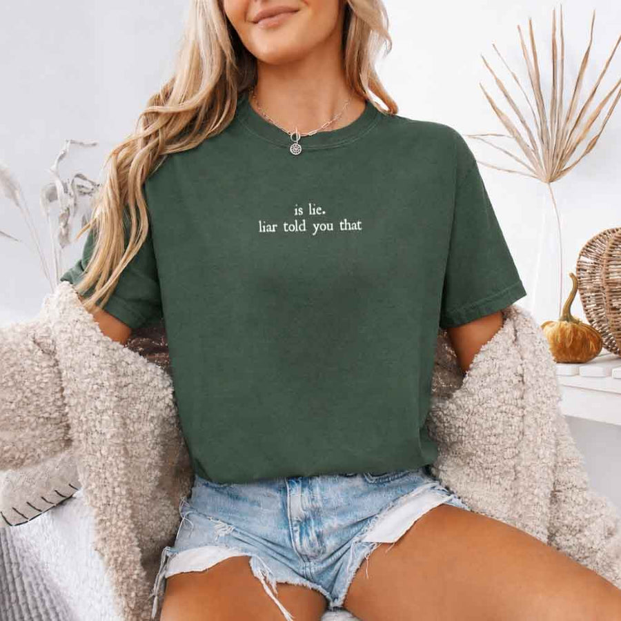 May include a person wearing a Moss Is Lie Liar Told You That Comfort Colors T-Shirt featuring rivalry inspired graphic and relaxed fit.