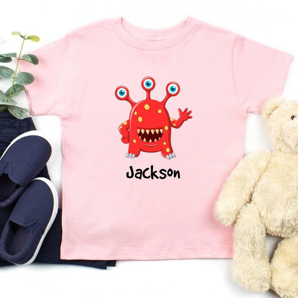 May include person wearing a pink I’ve Created Monsters Tee with bold humorous text design.
