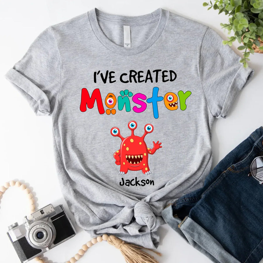 May include person wearing a grey I’ve Created Monsters Tee featuring playful parenting humor graphic.
