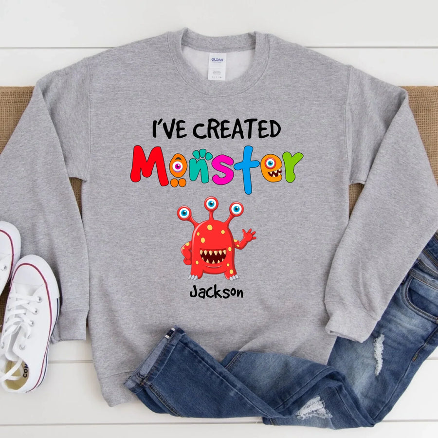 May include person wearing a grey I’ve Created Monsters Tee featuring playful parenting humor graphic.
