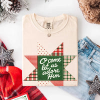 May include an O Come Let Us Adore Him Comfort Colors Christmas T-Shirt featuring a Christian holiday message inspired by a beloved Christmas hymn, designed for church services, family gatherings, worship events, and meaningful seasonal gifting.