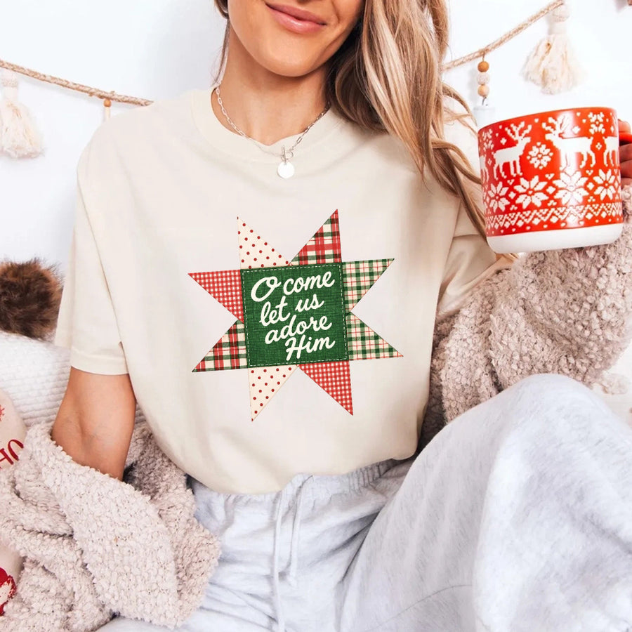 May include an O Come Let Us Adore Him Comfort Colors Christmas T-Shirt featuring a Christian holiday message inspired by a beloved Christmas hymn, designed for church services, family gatherings, worship events, and meaningful seasonal gifting.