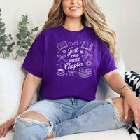May include a person wearing a Purple Just One More Chapter T-Shirt featuring trendy book lover graphic and relaxed fit.