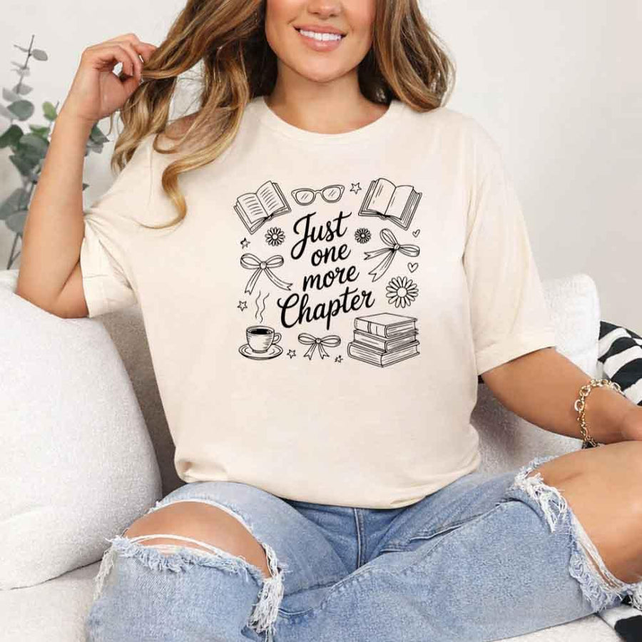 May include a person wearing a Soft Cream Just One More Chapter T-Shirt featuring trendy book lover graphic and relaxed fit.