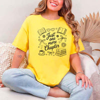 May include a person wearing a Daisy Just One More Chapter T-Shirt featuring trendy book lover graphic and relaxed fit.