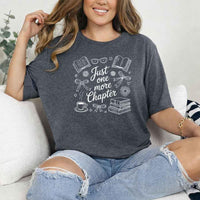 May include a person wearing a Dark Heather Just One More Chapter T-Shirt featuring trendy book lover graphic and relaxed fit.