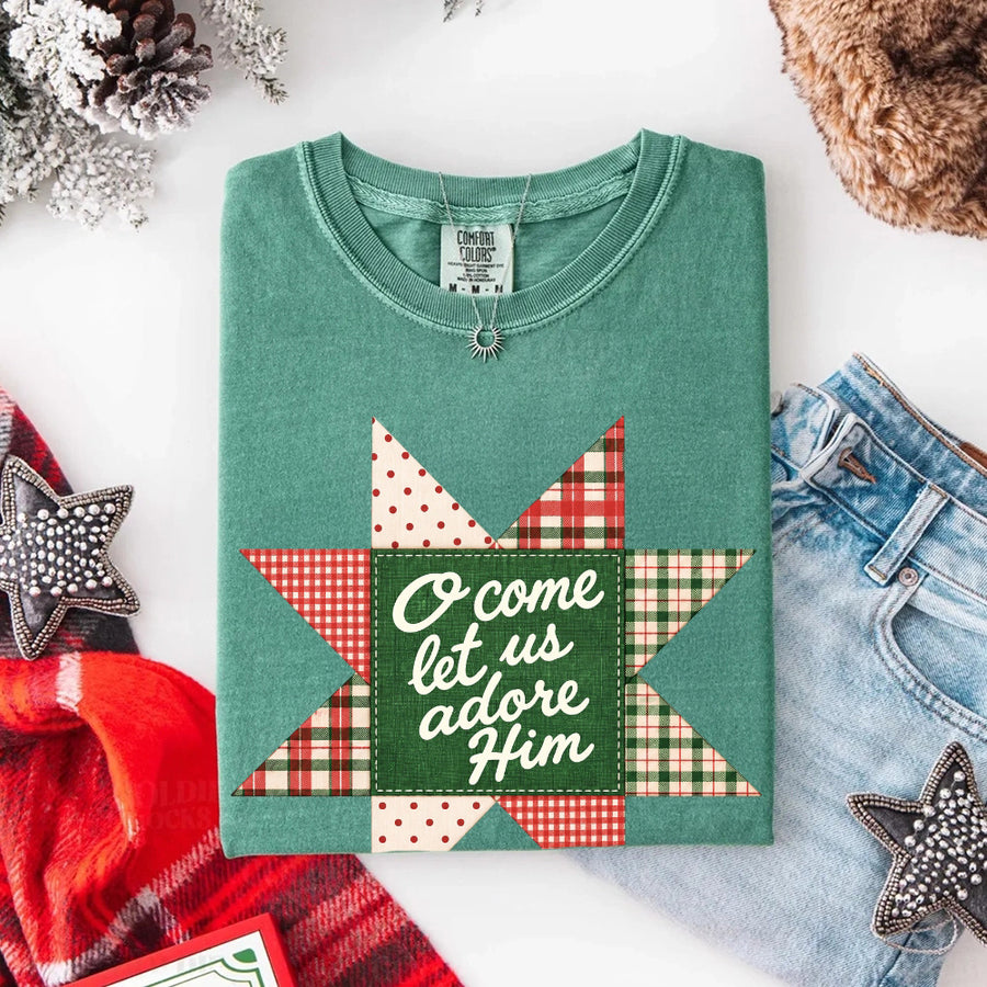 May include an O Come Let Us Adore Him Comfort Colors Christmas T-Shirt featuring a Christian holiday message inspired by a beloved Christmas hymn, designed for church services, family gatherings, worship events, and meaningful seasonal gifting.
