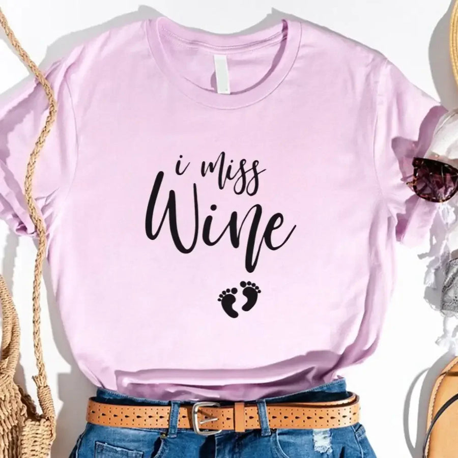 Lilac custom tee with 'I miss wine' text and baby footprints graphic, styled with jeans and belt
