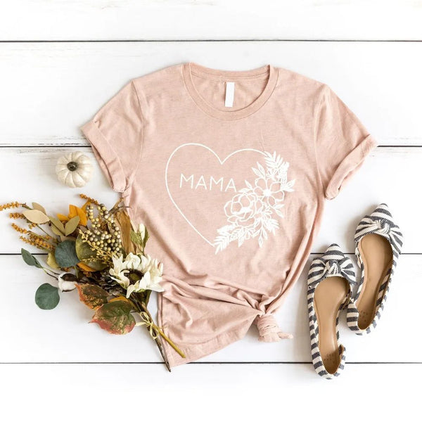 May include a minimalist “Mama” t-shirt with a small heart graphic, designed for moms and printed on soft cotton fabric.