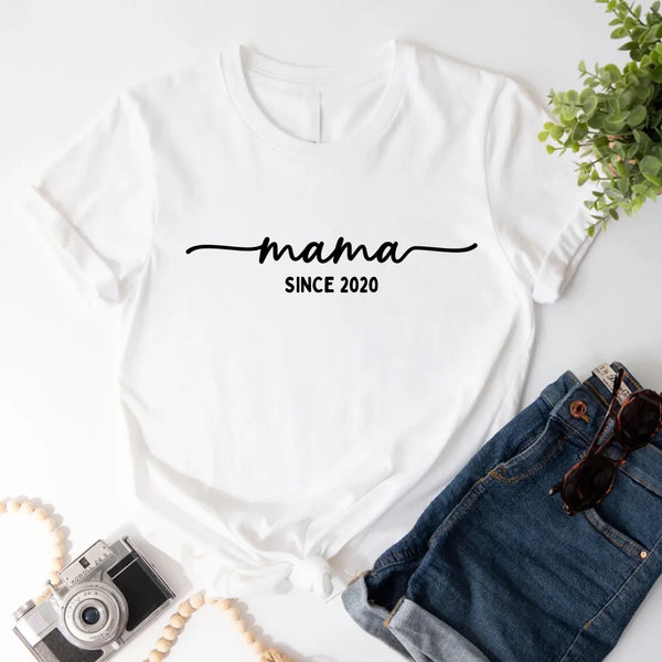 May include a personalized “Mama Since” shirt featuring minimalist lettering with a customizable year printed on the front.