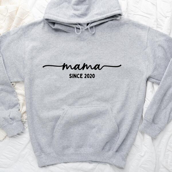 May include a personalized “Mama Since” shirt featuring minimalist lettering with a customizable year printed on the front.