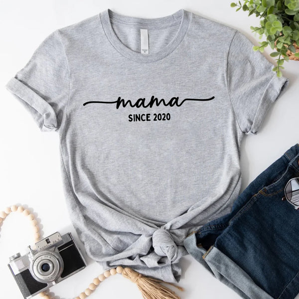 May include a personalized “Mama Since” shirt featuring minimalist lettering with a customizable year printed on the front.
