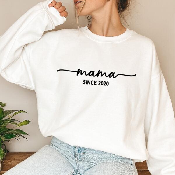 May include a personalized “Mama Since” shirt featuring minimalist lettering with a customizable year printed on the front.