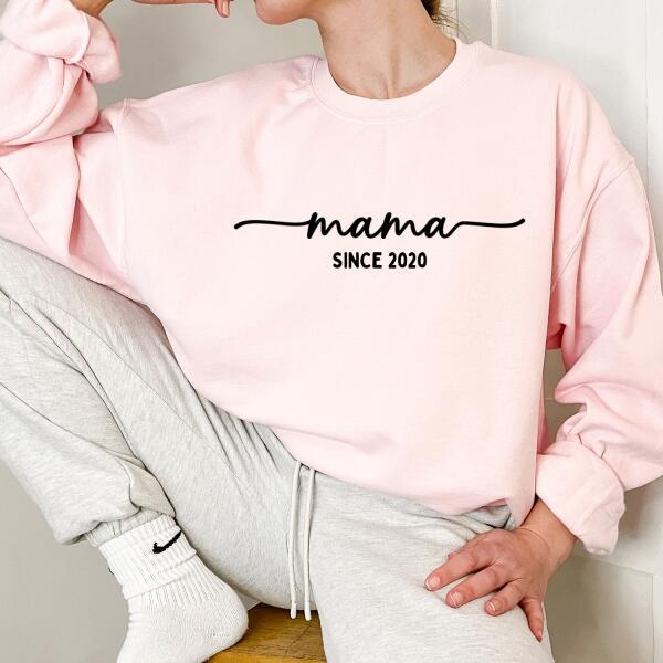 May include a personalized “Mama Since” shirt featuring minimalist lettering with a customizable year printed on the front.