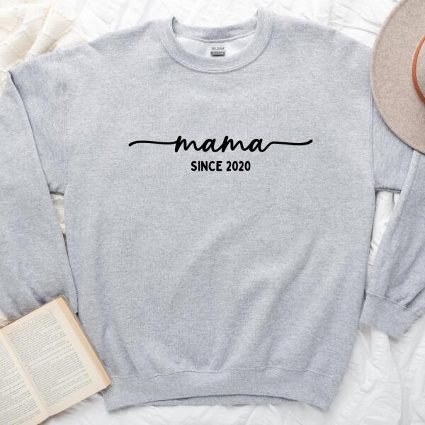 May include a personalized “Mama Since” shirt featuring minimalist lettering with a customizable year printed on the front.