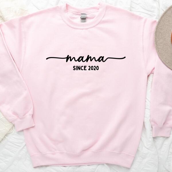 May include a personalized “Mama Since” shirt featuring minimalist lettering with a customizable year printed on the front.