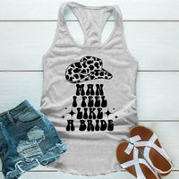 May include Grey “Man I Feel Like a Bride” bachelorette party tank top with country theme for bride squad celebration.