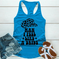 May include Blue “Man I Feel Like a Bride” bachelorette party tank top with country theme for bride squad celebration.