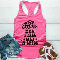 May include Pink “Man I Feel Like a Bride” bachelorette party tank top with country theme for bride squad celebration.