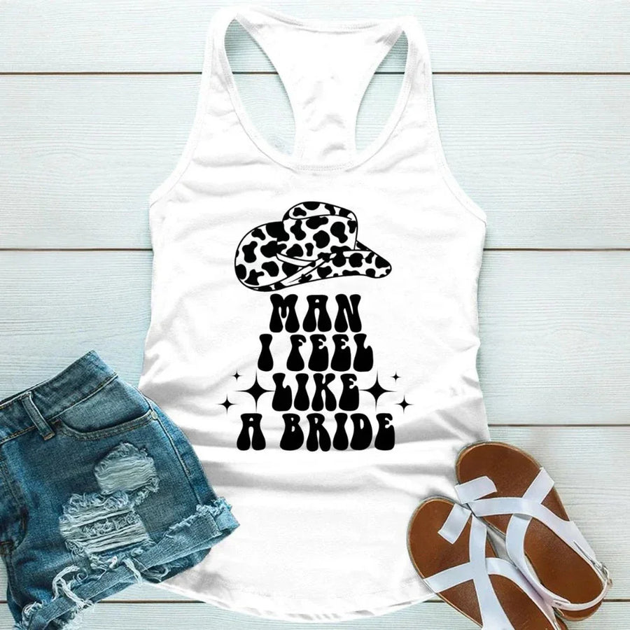 May include White “Man I Feel Like a Bride” bachelorette party tank top with country theme for bride squad celebration.