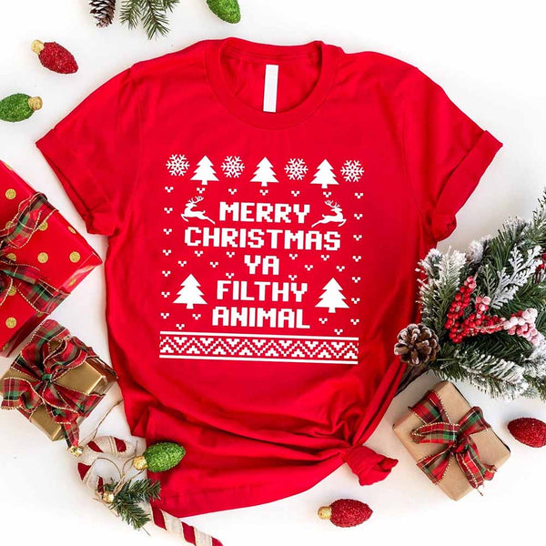 Red t-shirt with Christmas-themed text surrounded by holiday decorations on a white background