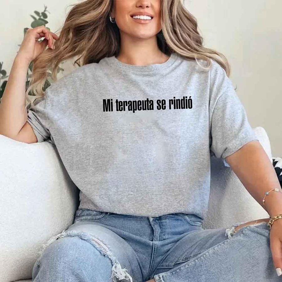 May include a person wearing a grey colored graphic t-shirt with the Spanish phrase “Mi Terapeuta Se Rindió”.