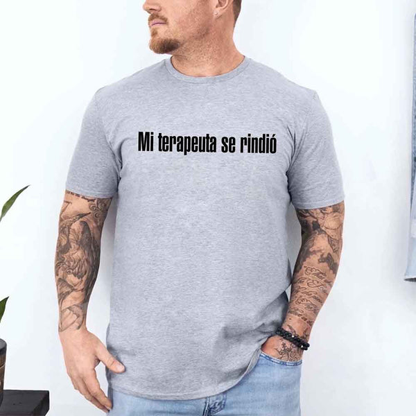 May include a person wearing a grey colored graphic t-shirt with the Spanish phrase “Mi Terapeuta Se Rindió”.